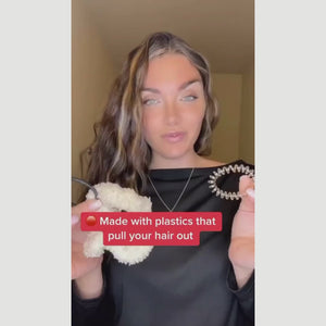 A woman shows how to use plastic-free hair ties.