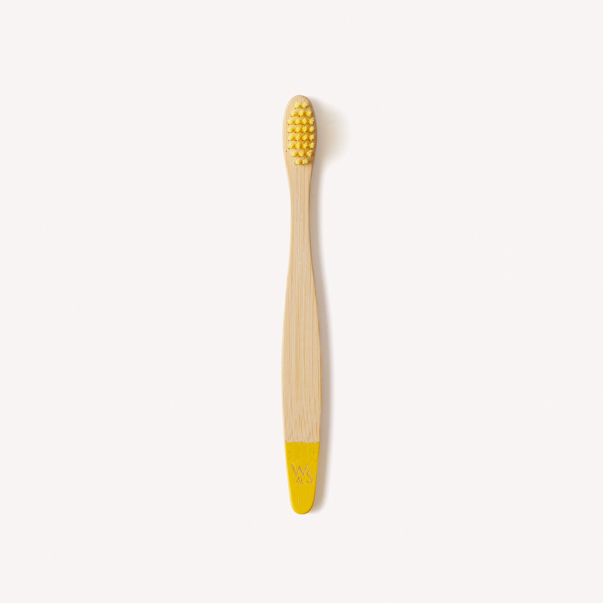Yellow children's bamboo toothbrush