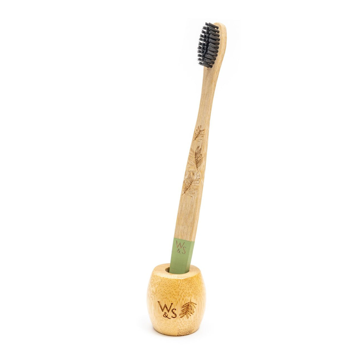 Bamboo Toothbrush Stand with green adult toothbrush.