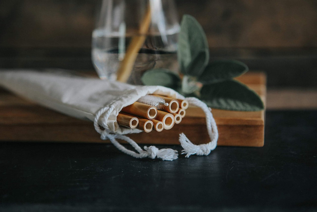 Reusable Bamboo Drinking Straws lying down in their packaging.