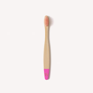 Pink children's bamboo toothbrush